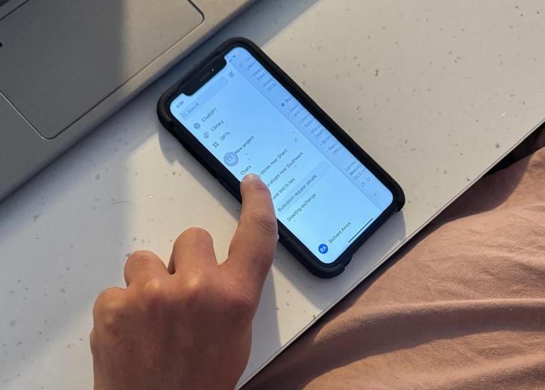 Rich accessing AI contnet on his phone