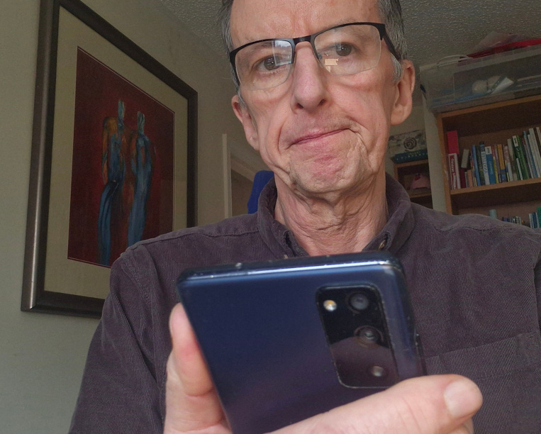 Pete Jackson accessing AI content from his phone